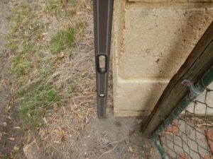 Spirit level showing wall out of level 