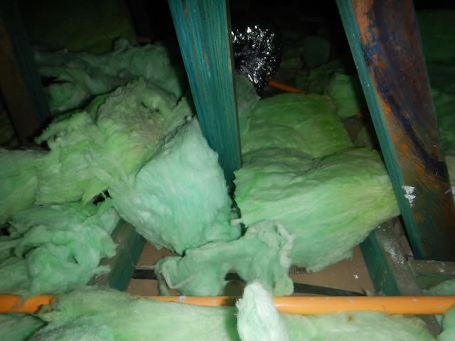 Poorly installed insulation noted during lockup inspection